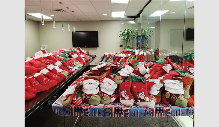 Twice per year, employees at Conley Group Inc. stuff hundreds of Christmas stockings for members of the armed forces.