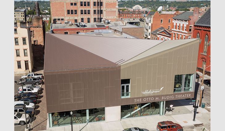The 38,000-square-foot building is defined by three intersecting triangular-shaped steel roof and wall panels to capture the creative spirit of the Shakespeare theater while providing a modern look in a historical setting.