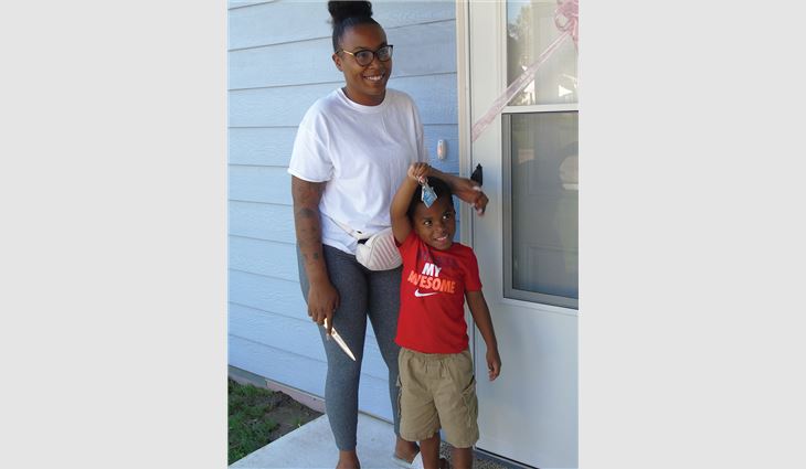 Denise Woolheater, a single
mom with six children, was the 2020 recipient
of Rhoden Roofing’s annual free roof system
giveaway. Workers removed four layers of
roofing material down to the deck, replaced
the roof deck and gutters, and installed new
asphalt shingles on Woolheater’s home.