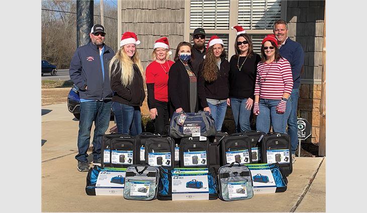 During a six-week period, whenever Arkansas Roofing
Kompany sold a new roof system, employees purchased
a new suitcase along with toiletry items for a child in
Faulkner County’s foster care system.