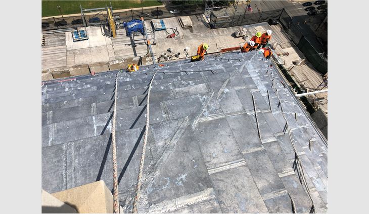 On the ziggurat roof, workers
removed the existing lead sheet
roof system down to limestone
risers, replaced risers as needed
and then applied primer and
underlayment.