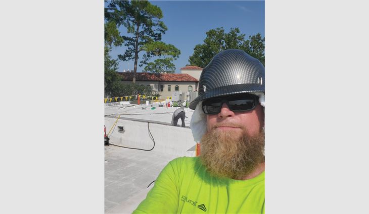 Dudek takes a selfie on a roof.