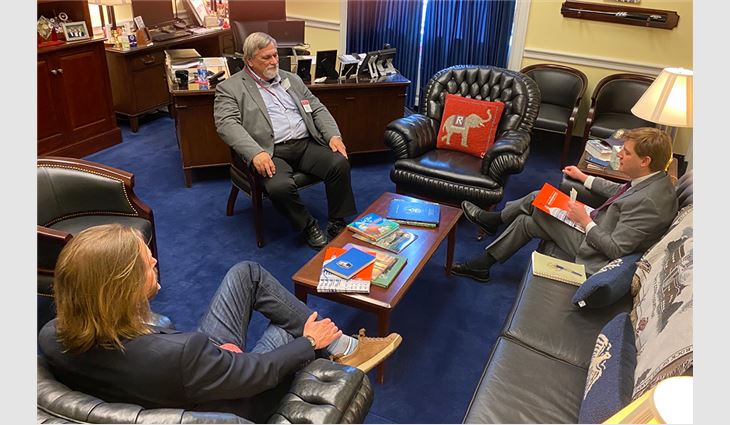 Allen Lancaster, vice president of Metalcrafts, a Tecta America company LLC, Savannah, Ga., and Geoff Mitchell, CEO of Mid-South Roof Systems, Forest Park, Ga., meet with their representative from Georgia.