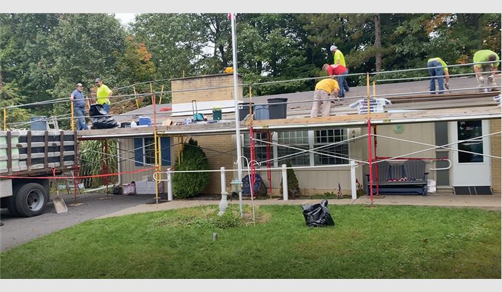 Employees at R.H. Marcon Inc., State College, Pa., installed a new roof system during United Way’s Day of Caring. 