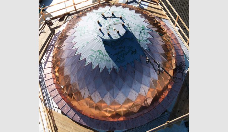CopperWorks craftsmen fabricated 288 interlocking copper tiles using traditional Rauten methods.